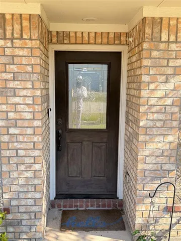a front view of a house with a glass door