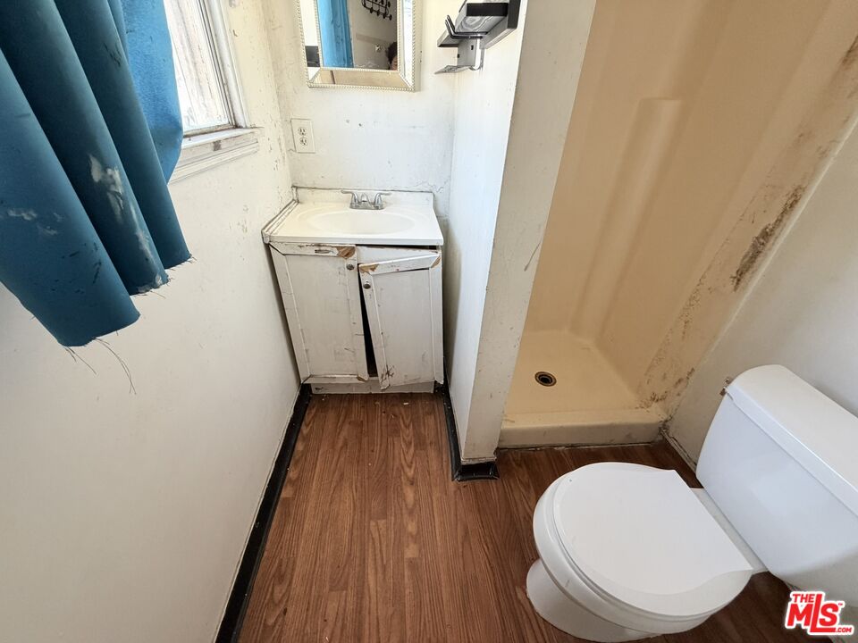 12918 Shreve Road Whittier, CA 90602 - Photo 40 of 42 a white toilet sitting next to a sink