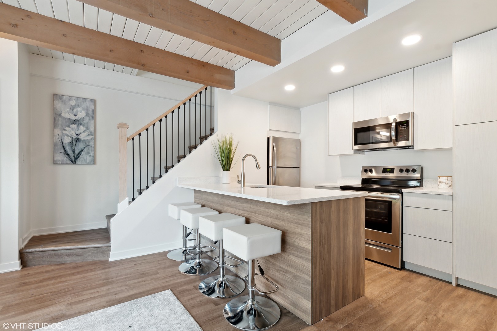 1908 Green Bay Road, Unit H Highland Park, IL 60035 - Photo 4 of 9 a kitchen with granite countertop a stove a sink and a microwave