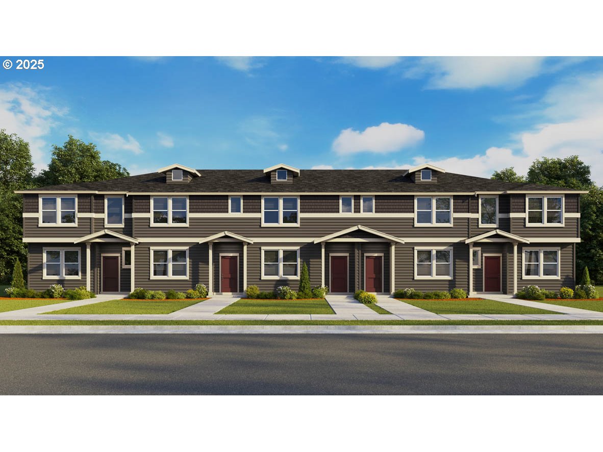 a front view of a building with a garden