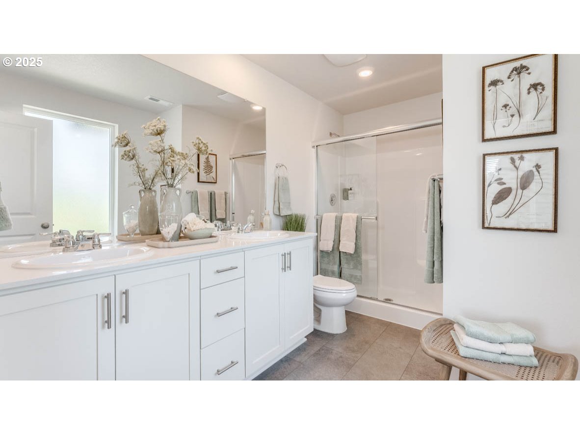 3541 Southwest Thomas Avenue Gresham, OR 97080 - Photo 24 of 25 a bathroom with a sink a toilet and a mirror