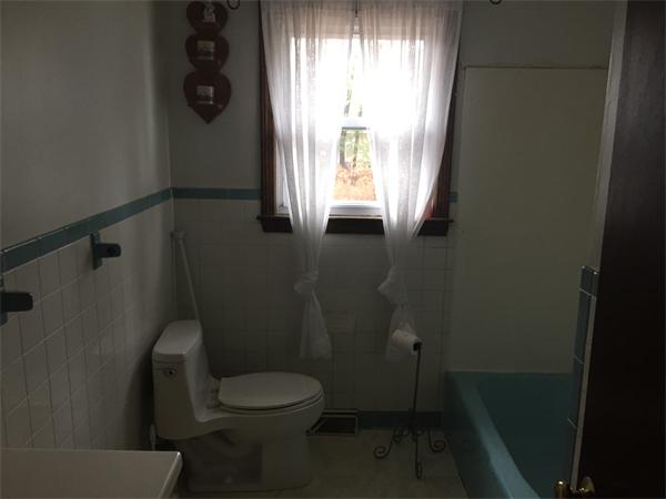 46 Heritage Road Billerica, MA 01821 - Photo 8 of 13 a bathroom with a toilet and a window