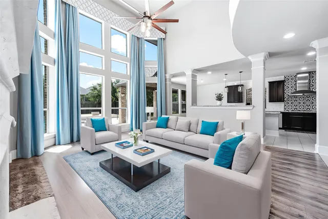 a view of a livingroom with wooden floor and a fireplace