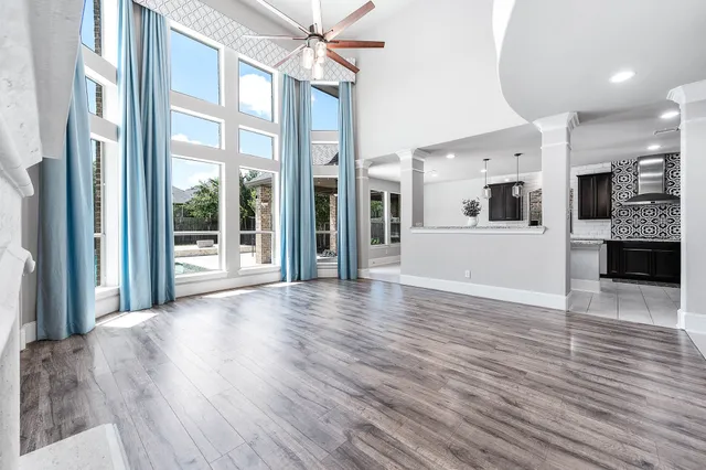 a kitchen with stainless steel appliances granite countertop a sink and a stove
