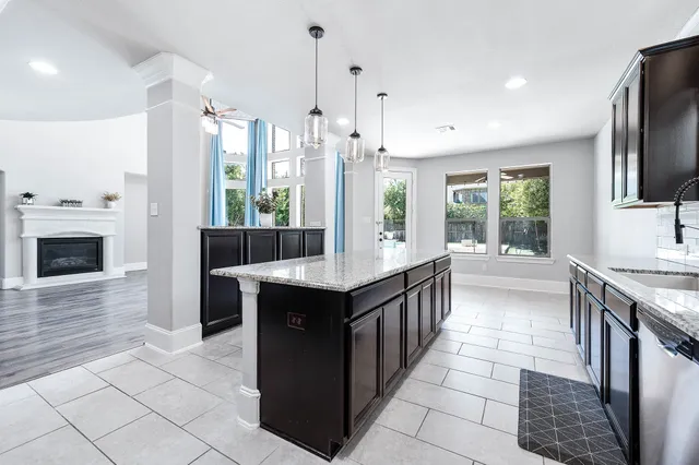 a spacious bathroom with a tub sink and mirror
