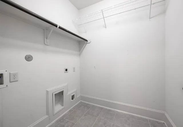 a spacious bathroom with a tub a sink and a large mirror