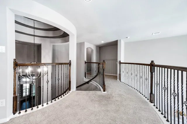 a view of a room with wooden floor and windows