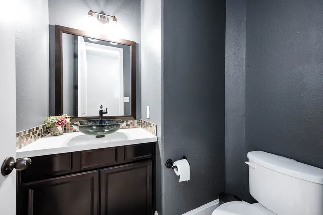 a living room with furniture a large window and a table