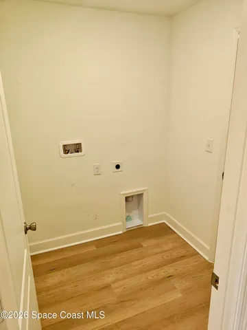 a view of room with furniture and cabinets