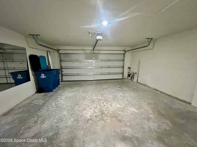 a view of a house with backyard and porch