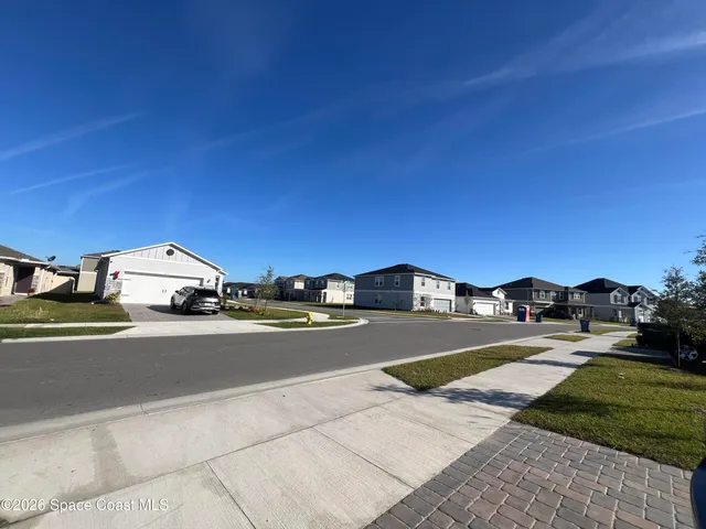 a table and chairs sitting in the middle of a lake