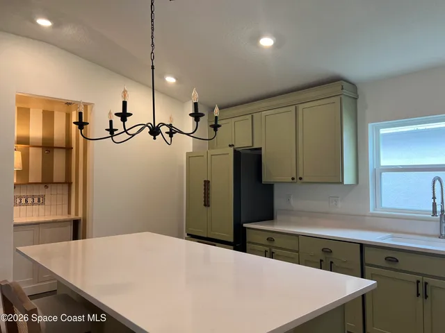 a bedroom with a bed and a cabinet