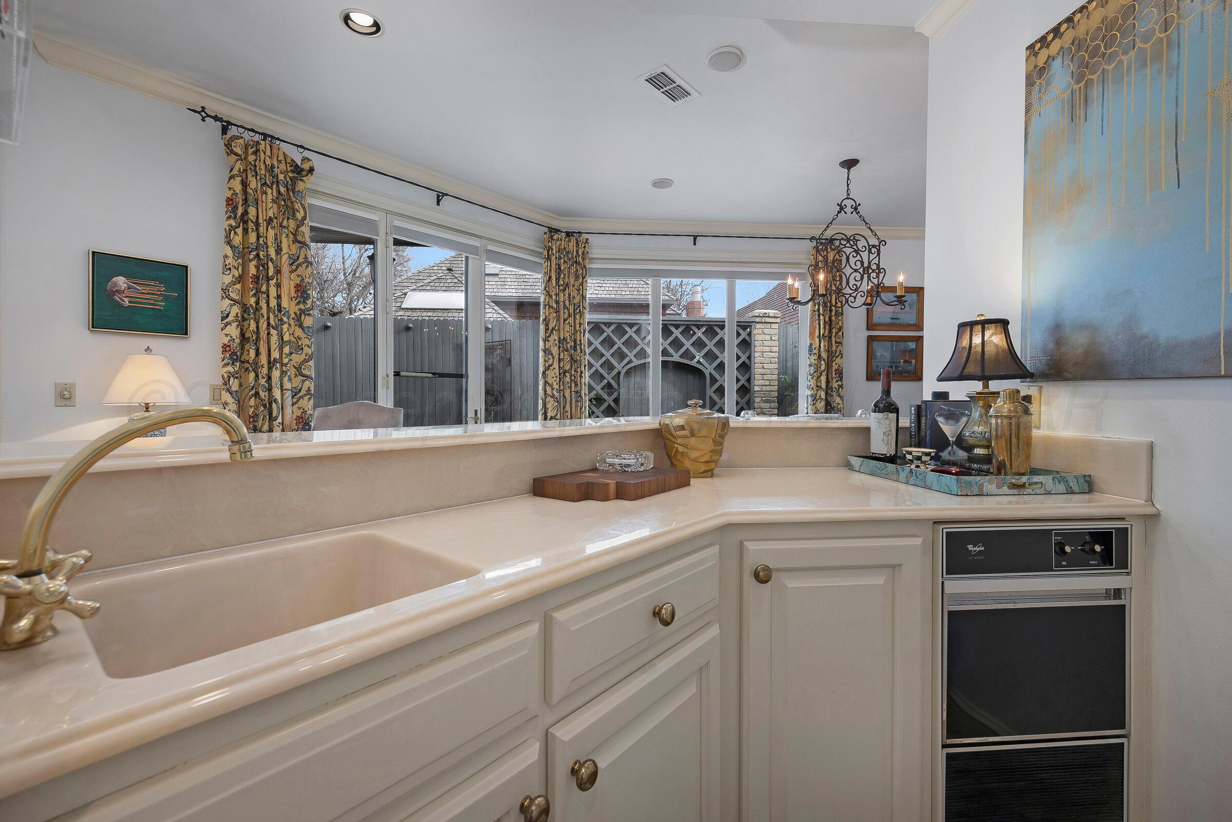 1 Gunn Court Amarillo, TX 79106 - Photo 18 of 36 a kitchen with a sink and cabinets