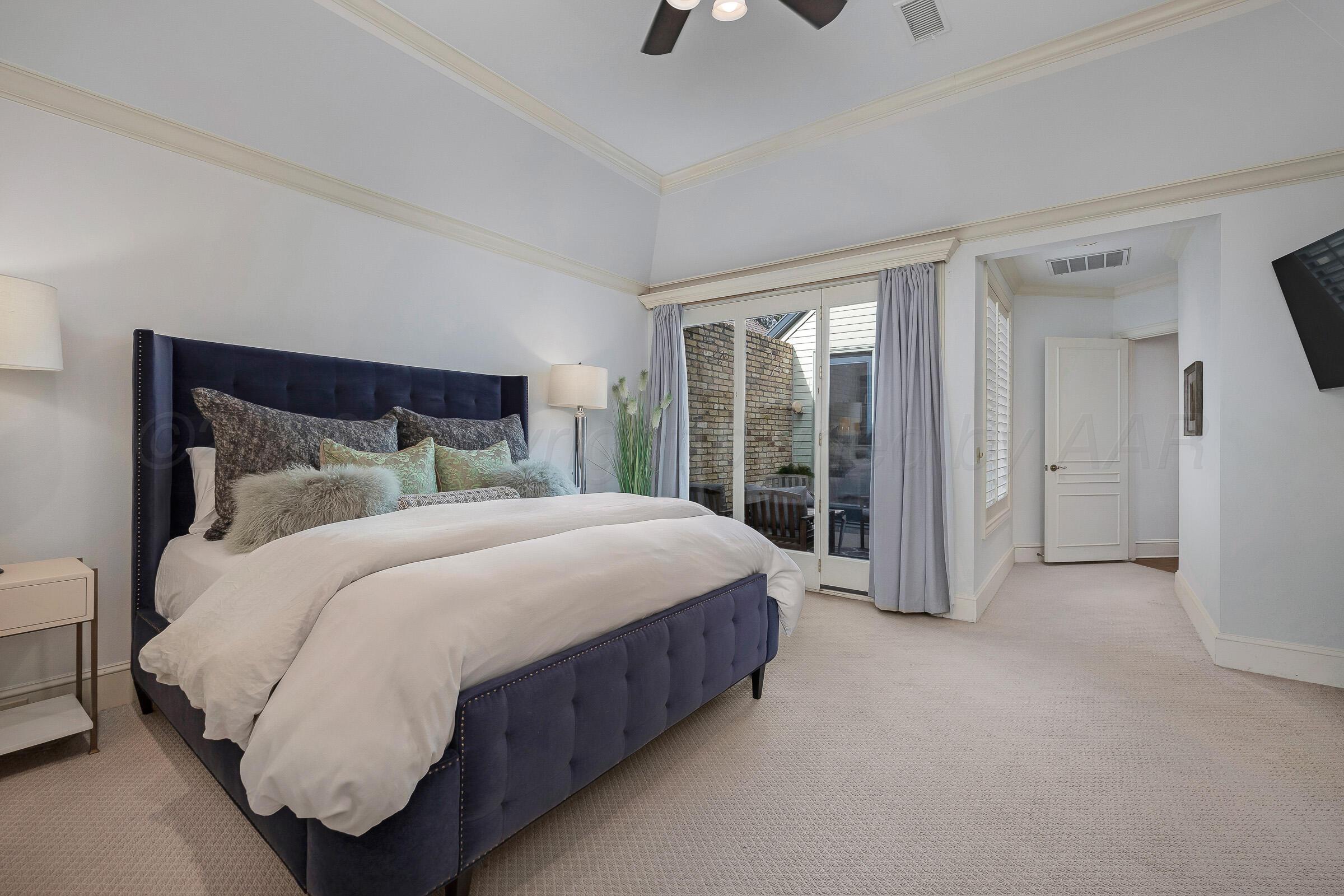 1 Gunn Court Amarillo, TX 79106 - Photo 22 of 36 a spacious bedroom with a bed and large window