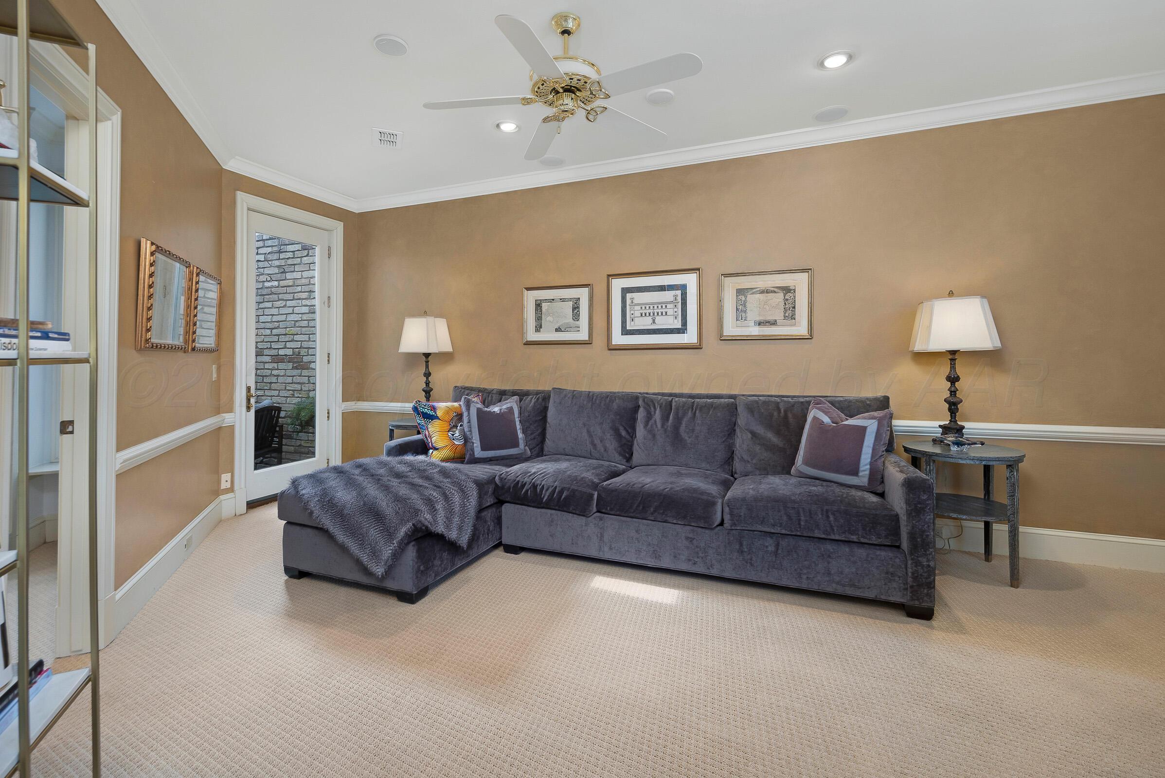 1 Gunn Court Amarillo, TX 79106 - Photo 29 of 36 a living room with a couch and a chandelier