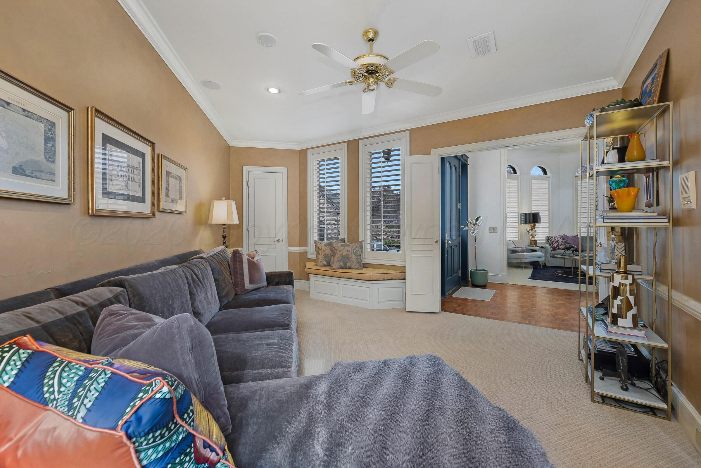 1 Gunn Court Amarillo, TX 79106 - Photo 30 of 36 a living room with furniture and a flat screen tv