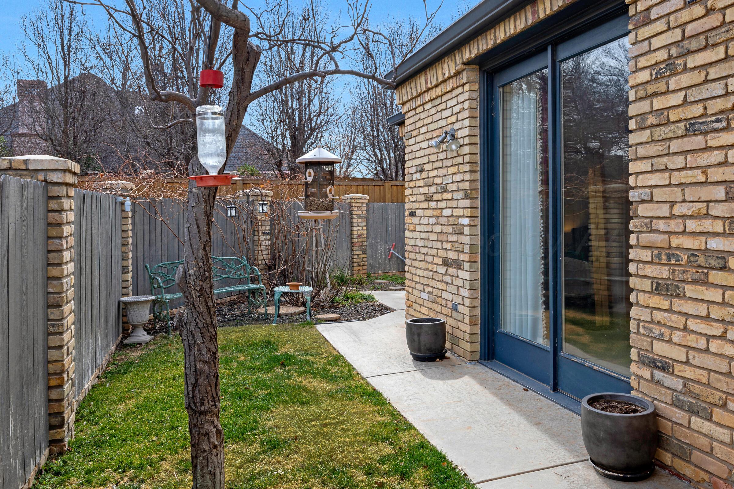 1 Gunn Court Amarillo, TX 79106 - Photo 35 of 36 a view of a patio with chairs and potted plants