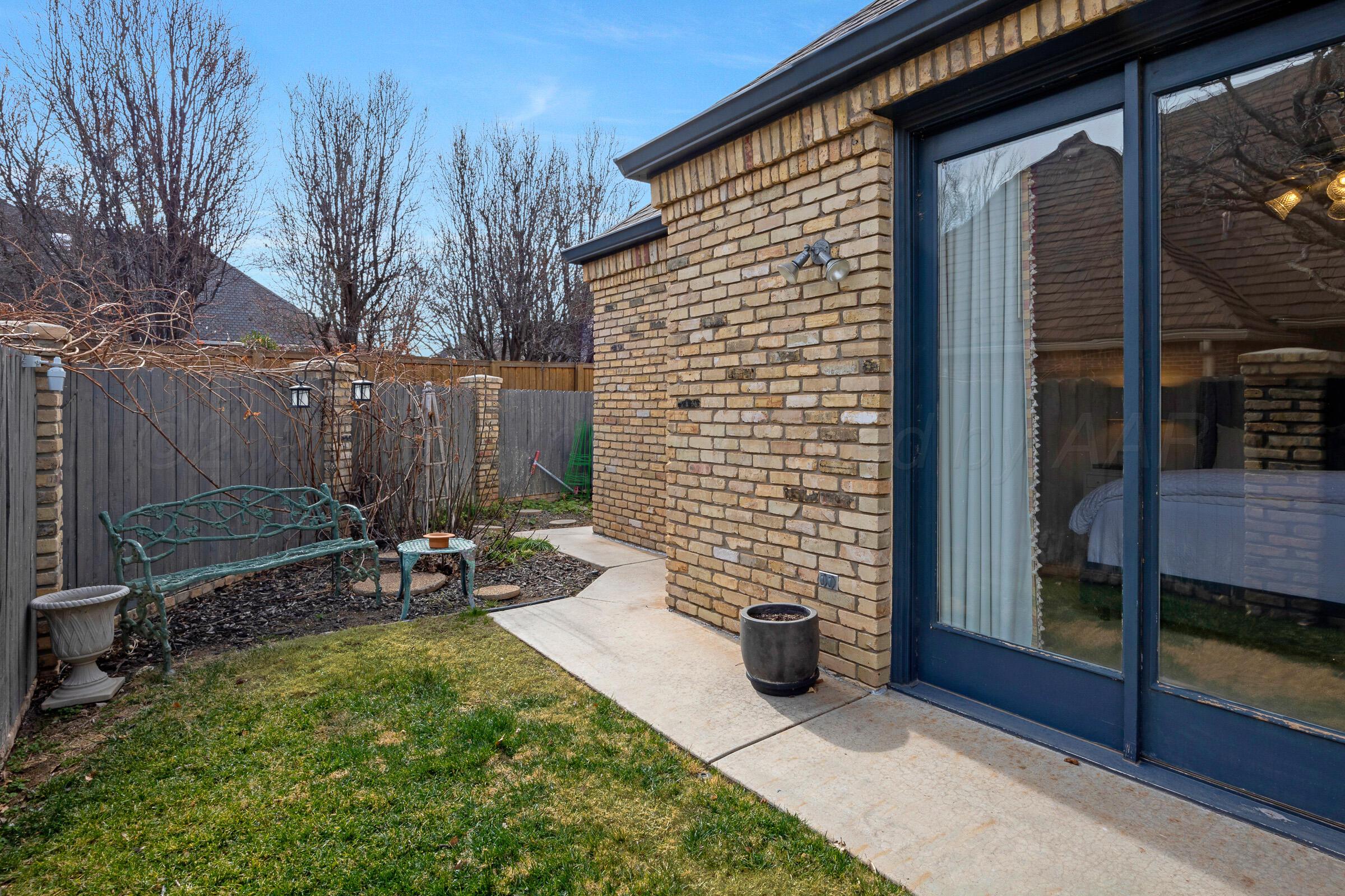 1 Gunn Court Amarillo, TX 79106 - Photo 36 of 36 a view of a chair and table in backyard of the house