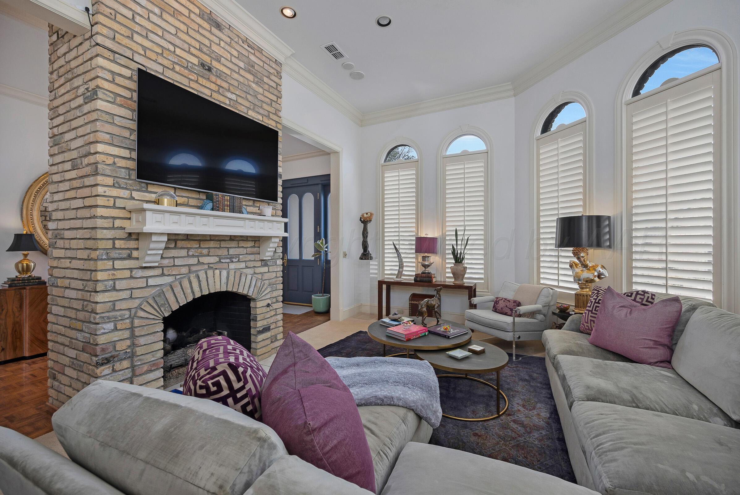 1 Gunn Court Amarillo, TX 79106 - Photo 6 of 36 a living room with furniture fireplace and flat screen tv
