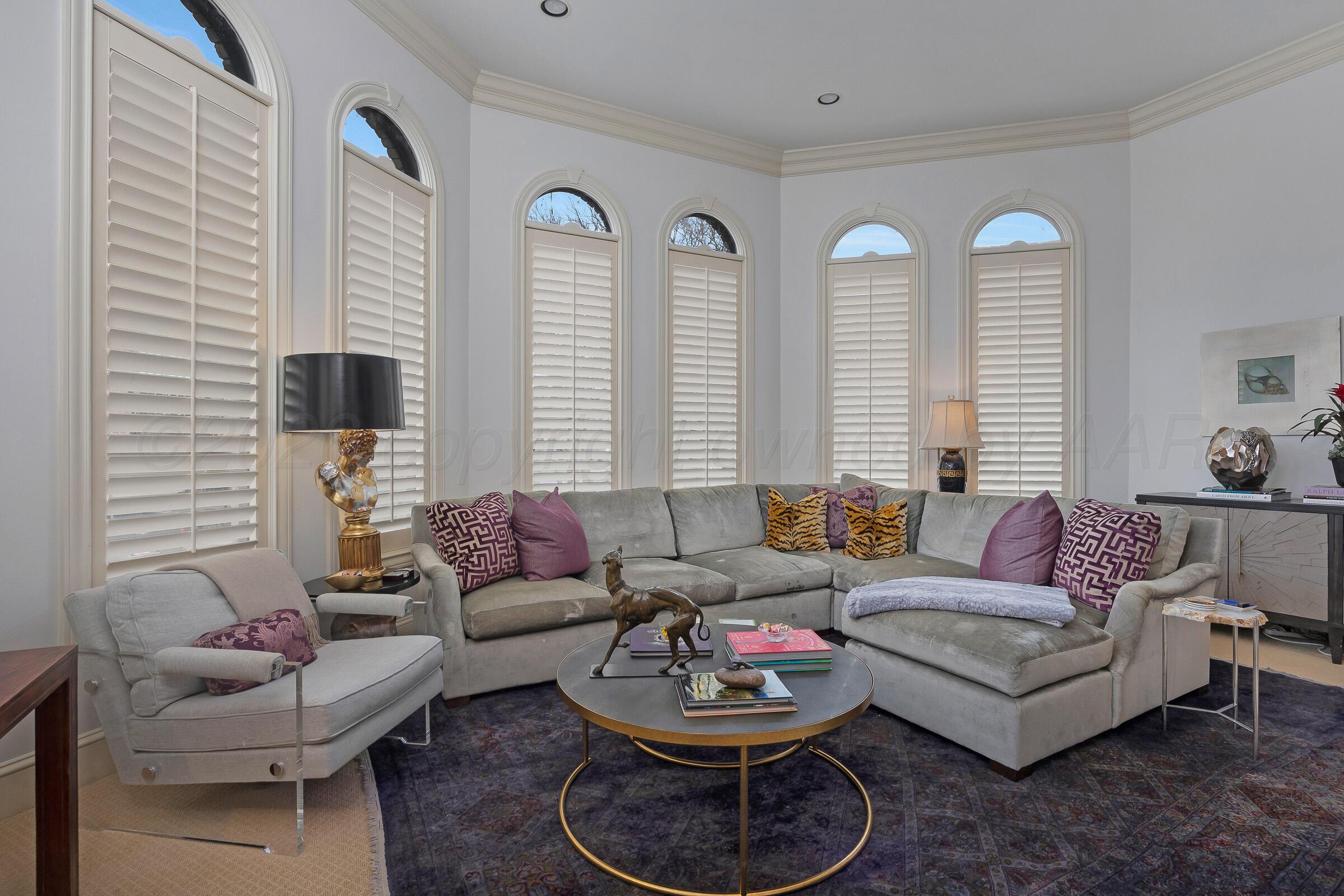 1 Gunn Court Amarillo, TX 79106 - Photo 7 of 36 a living room with furniture and a large window