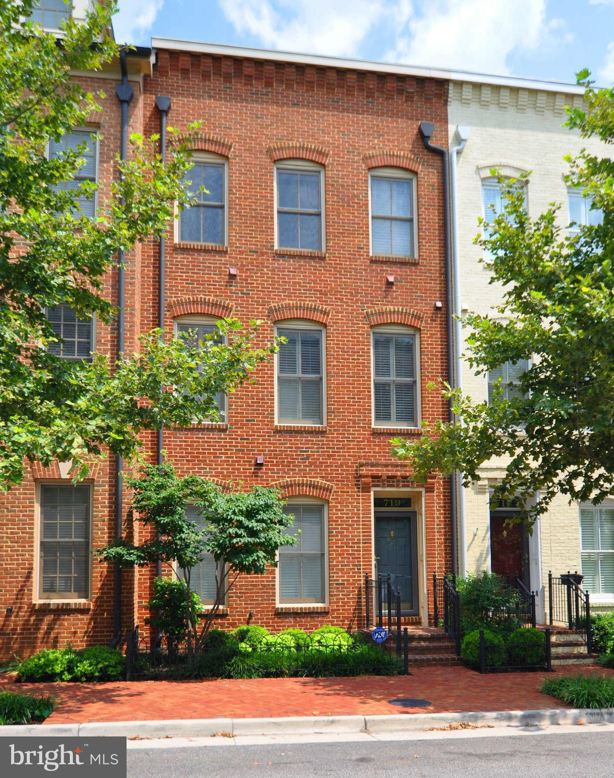 719 Carpenter Road Alexandria, VA 22314 - Photo 1 of 26 a front view of a house having yard