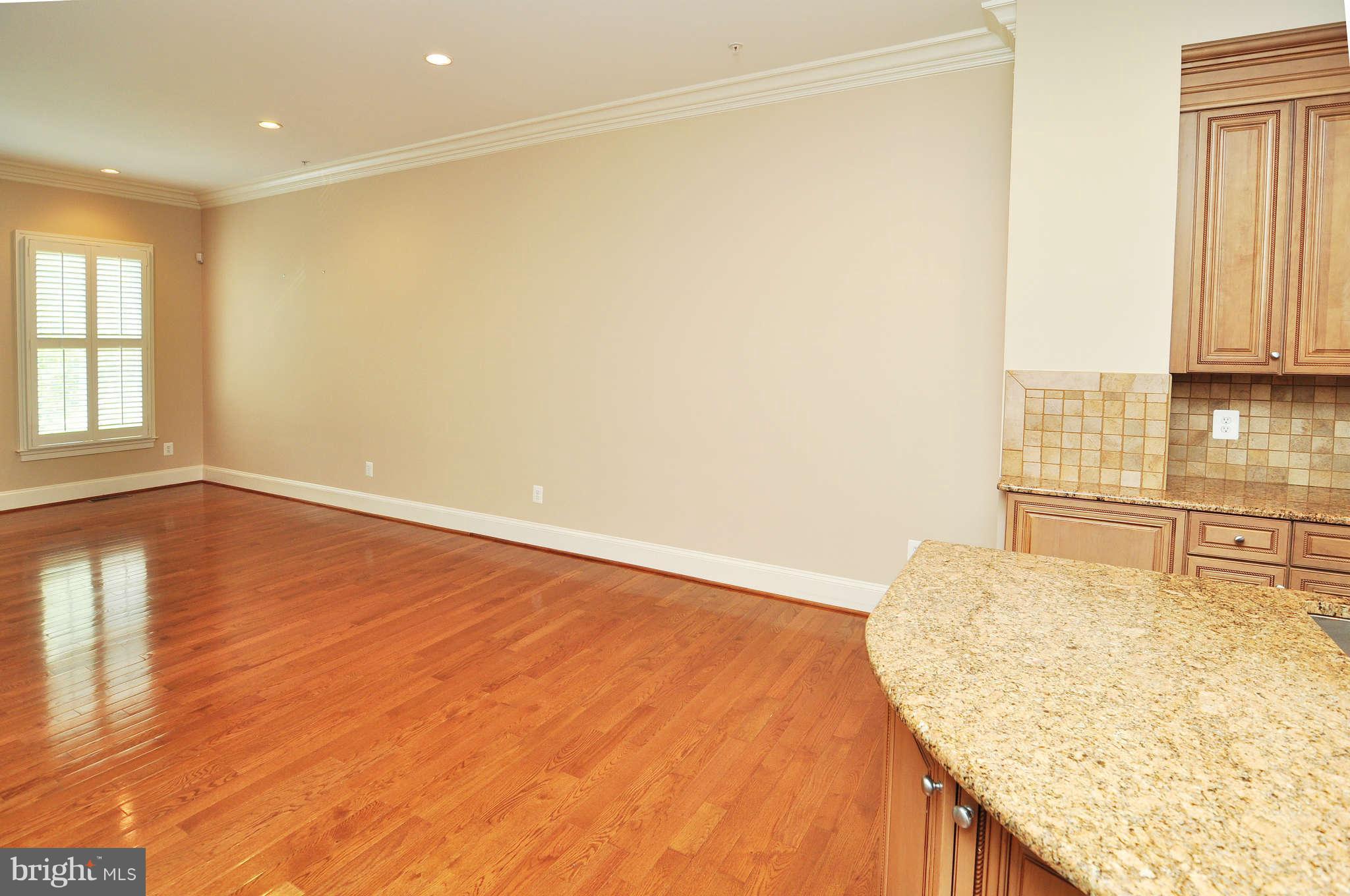 719 Carpenter Road Alexandria, VA 22314 - Photo 10 of 26 a view of kitchen and wooden floor