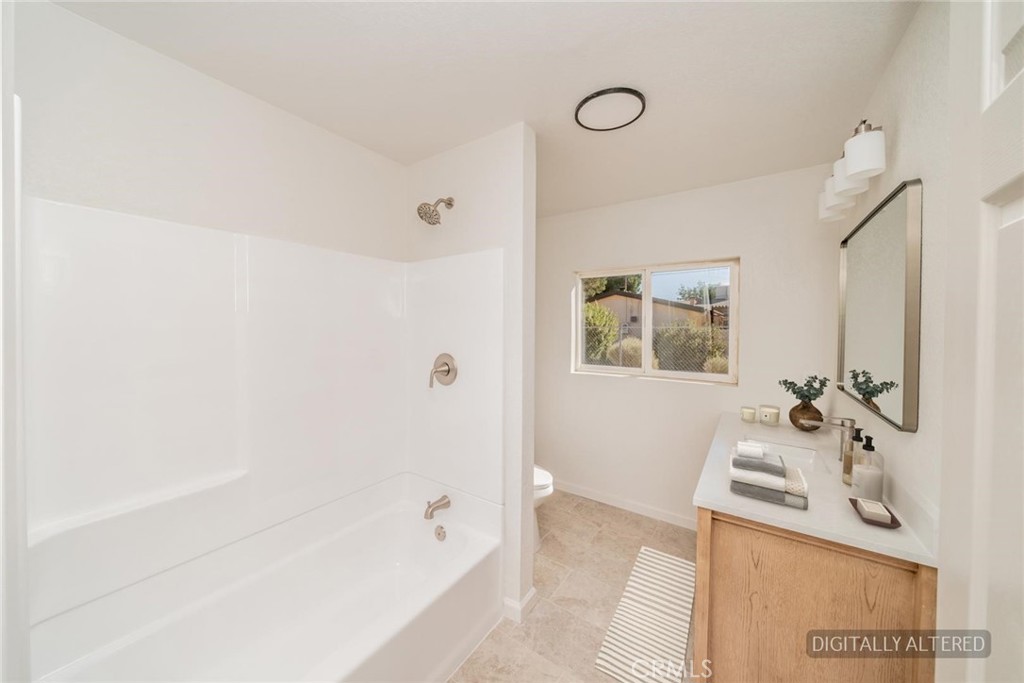 14387 Jicarilla Road Apple Valley, CA 92307 - Photo 14 of 24 Guest Bathroom (Disclaimer: Some images have been digitally enhanced with virtual staging to illustrate potential room layouts and furnishings. Actual property condition and features may vary. Buyer to verify all information independently).