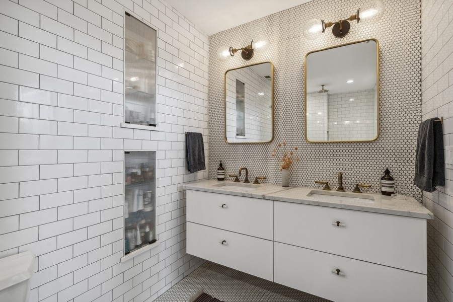 1500 West Monroe Street, Unit 425 Chicago, IL 60607 - Photo 18 of 33 a bathroom with a double vanity sink mirror and
