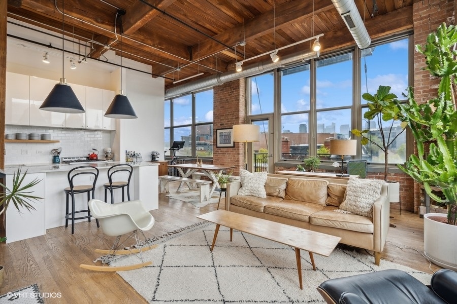 1500 West Monroe Street, Unit 425 Chicago, IL 60607 - Photo 4 of 33 a living room with lots of furniture and a potted plant