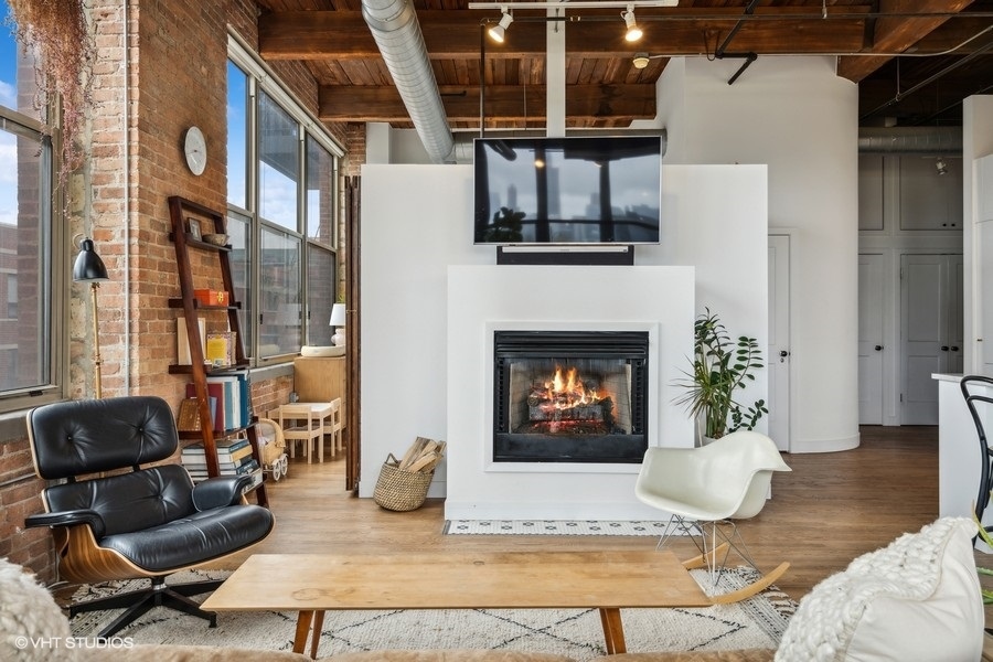1500 West Monroe Street, Unit 425 Chicago, IL 60607 - Photo 6 of 33 a living room with furniture and a fireplace