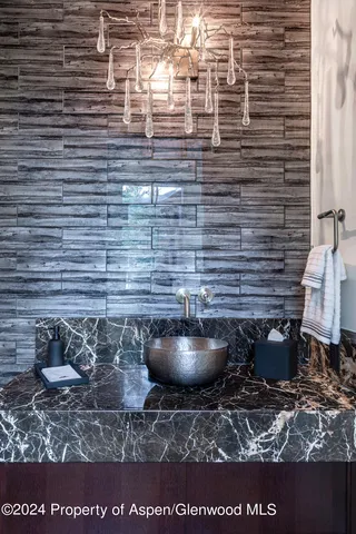 a living room with furniture a window and a painting