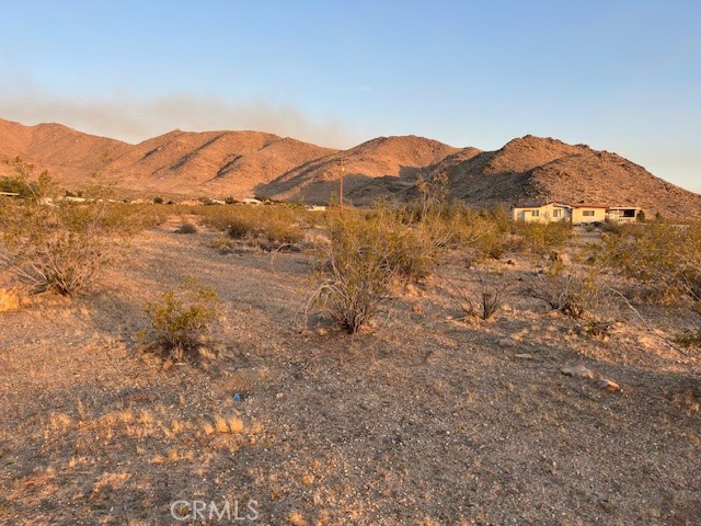 20 Old Mine Road Apple Valley, CA 92307 - Photo 3 of 6 a view of a mountain range in a cloudy sky
