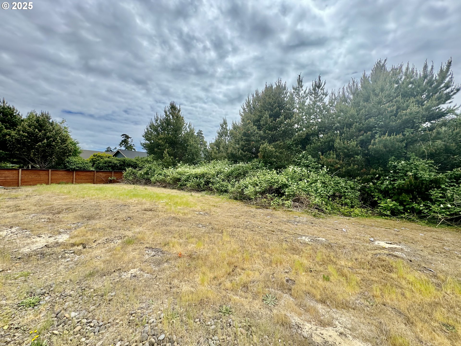 Lake Point Drive, Unit 23 Florence, OR 97439 - Photo 10 of 13 a view of a yard with a fountain