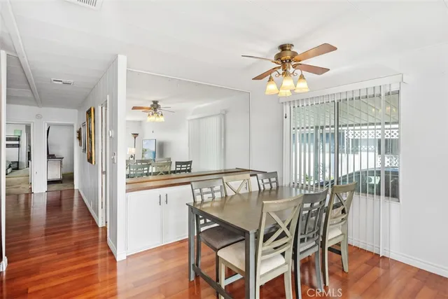 a view of a dining room with furniture window and wooden floor