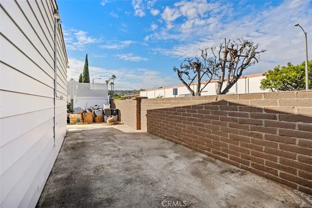 a view of a backyard of the house