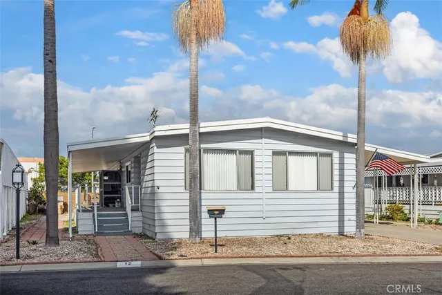 a front view of a house with stairs