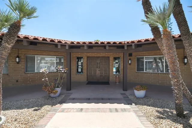 a view of a swimming pool with a patio