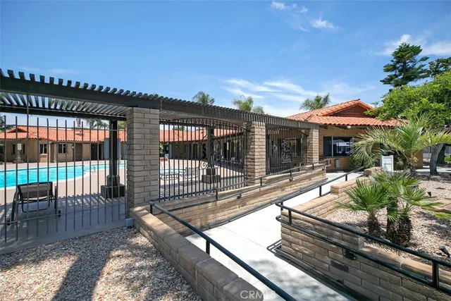a view of a house with swimming pool and a yard