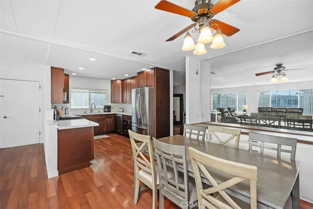 a large kitchen with a table and chairs