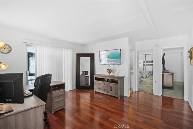 a view of a livingroom with furniture and wooden floor