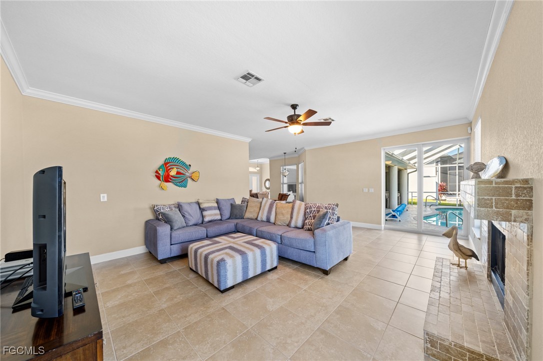 5025 Southwest 10th Avenue Cape Coral, FL 33914 - Photo 11 of 44 a living room with furniture and a flat screen tv