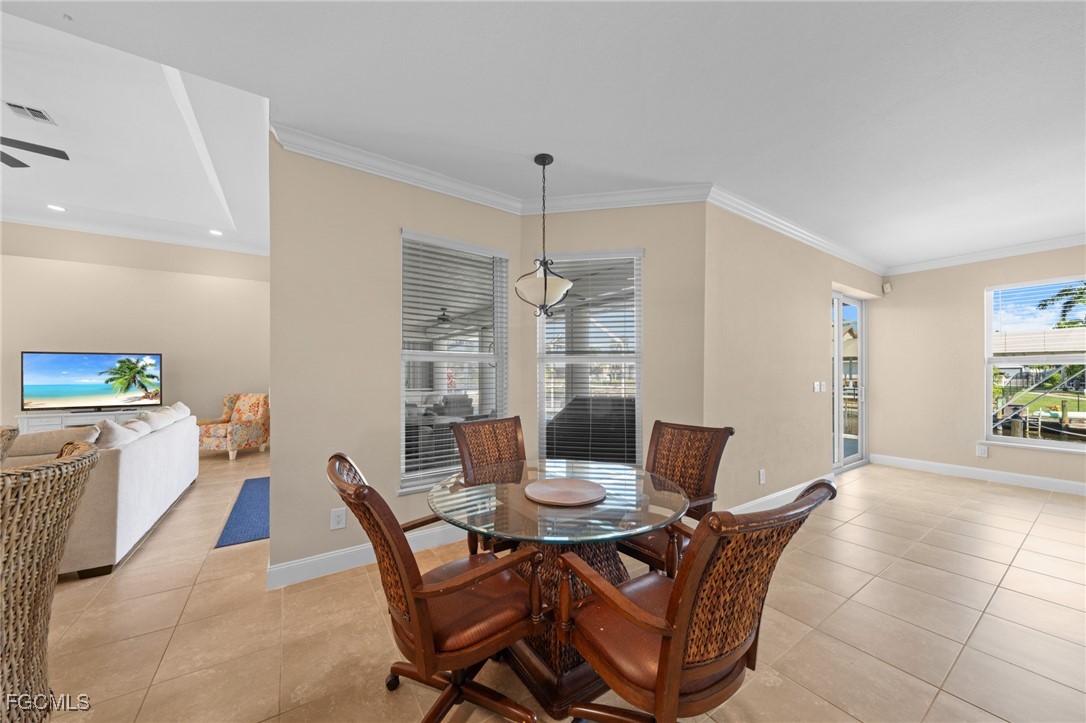 5025 Southwest 10th Avenue Cape Coral, FL 33914 - Photo 20 of 44 a view of a dining room with furniture and window
