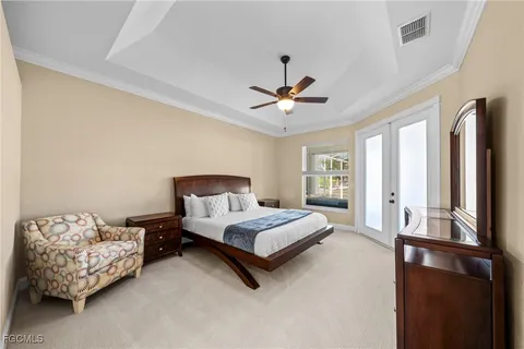 a bed sitting in a bedroom next to a window