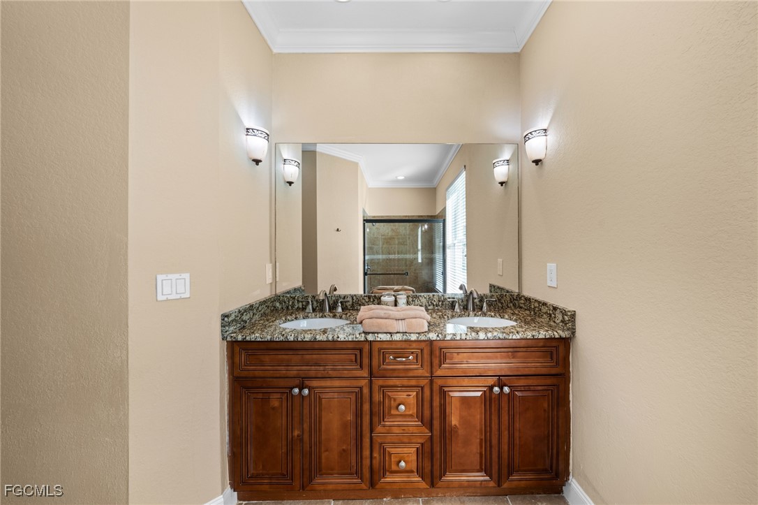 5025 Southwest 10th Avenue Cape Coral, FL 33914 - Photo 24 of 44 a bathroom with a granite countertop sink and a mirror