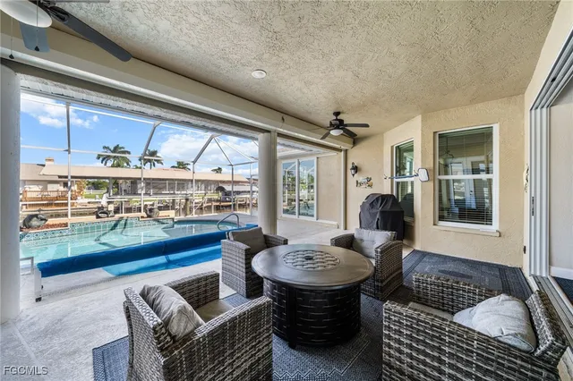 a outdoor living space with furniture and a floor to ceiling window