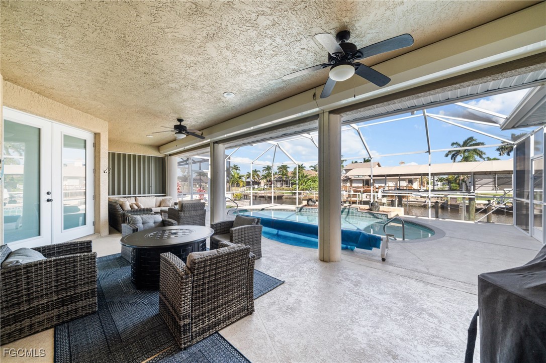5025 Southwest 10th Avenue Cape Coral, FL 33914 - Photo 34 of 44 a living room with furniture and a large window
