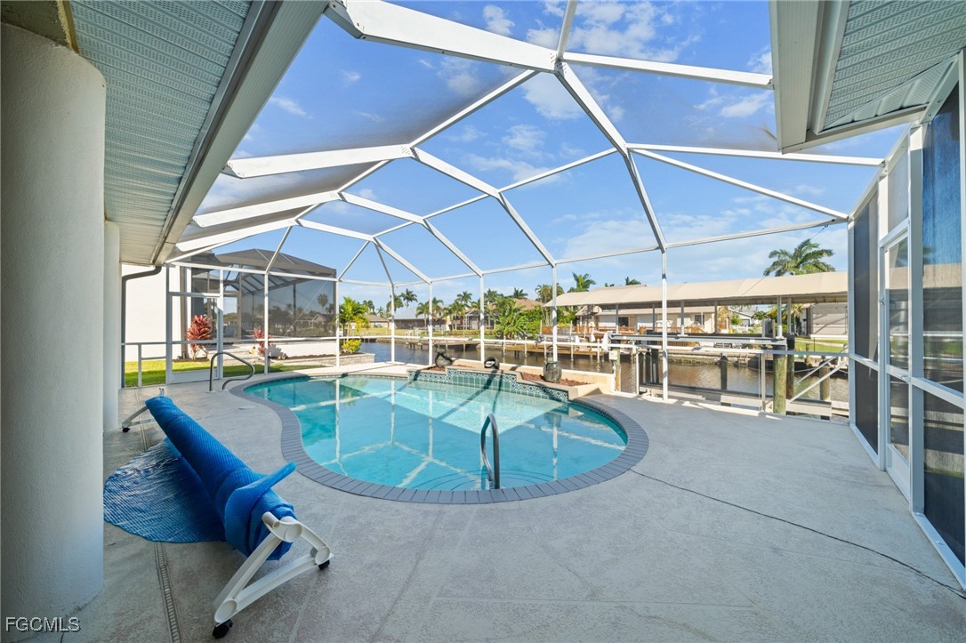 5025 Southwest 10th Avenue Cape Coral, FL 33914 - Photo 35 of 44 a view of a swimming pool with a patio