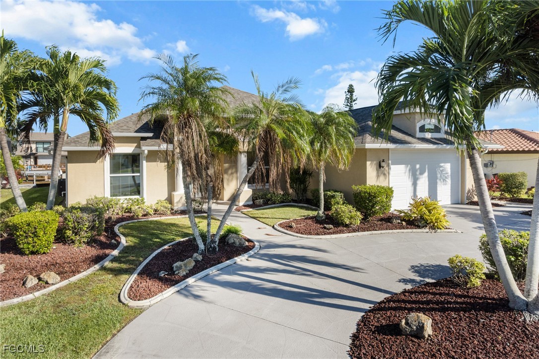 5025 Southwest 10th Avenue Cape Coral, FL 33914 - Photo 41 of 44 a front view of a house with porch and furniture