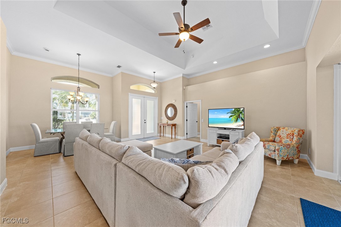 5025 Southwest 10th Avenue Cape Coral, FL 33914 - Photo 7 of 44 a living room with furniture and a large window