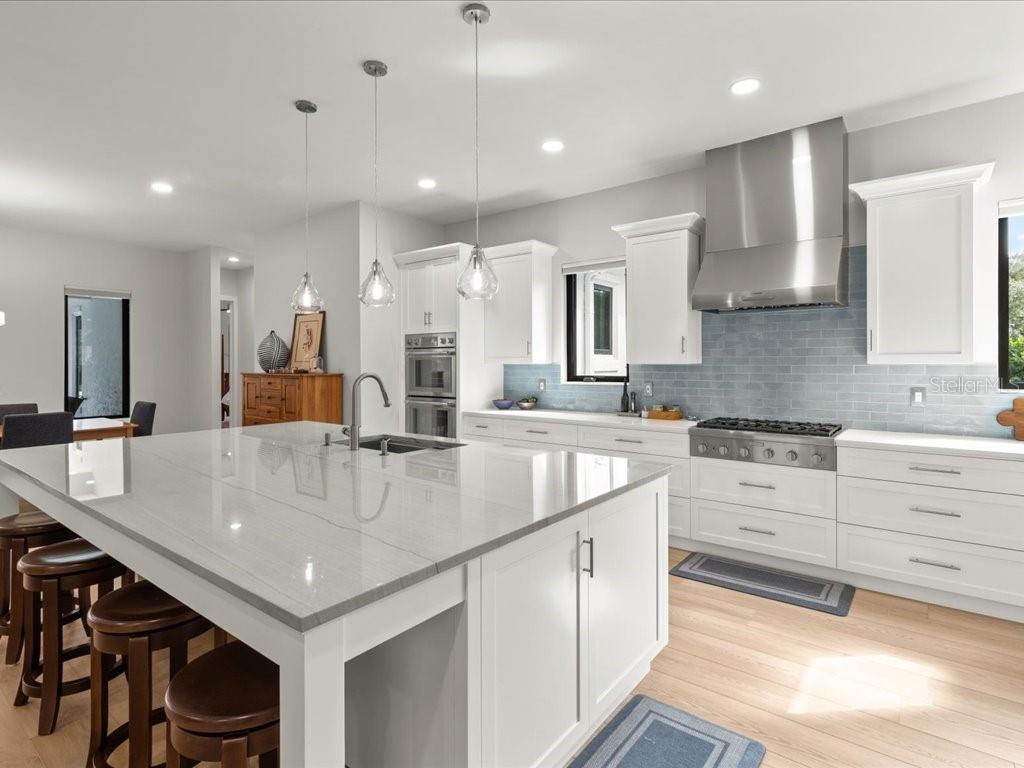 3937 West Shadow Creek Loop Lecanto, FL 34461 - Photo 11 of 65 a large kitchen with kitchen island a sink appliances and a counter top space